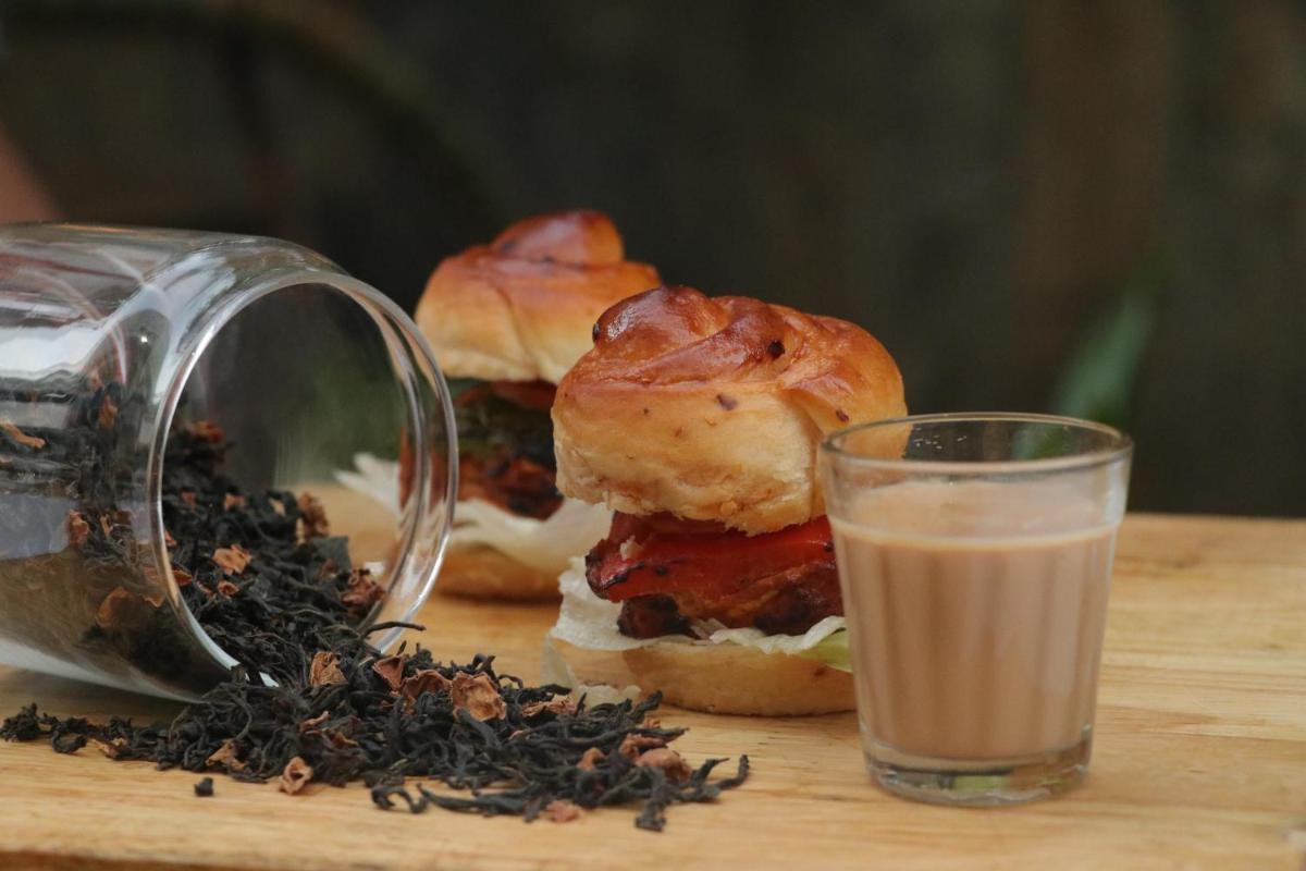 a close up of a sandwich with a glass of milk at Crowne Plaza Pune City Centre by IHG in Pune
