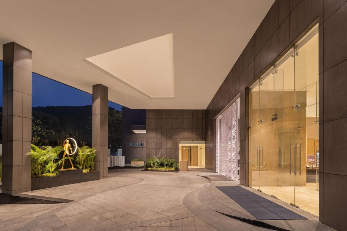 a lobby of a building with large glass doors at Fairfield by Marriott Dehradun in Dehradun
