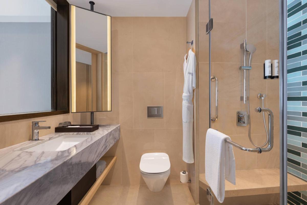 a bathroom with a sink and a toilet and a shower at Fairfield by Marriott Dehradun in Dehradun