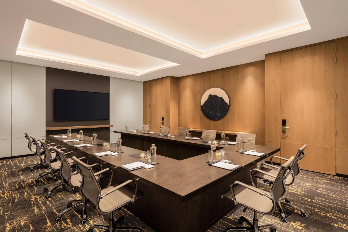 a large conference room with a large table and chairs at Fairfield by Marriott Dehradun in Dehradun