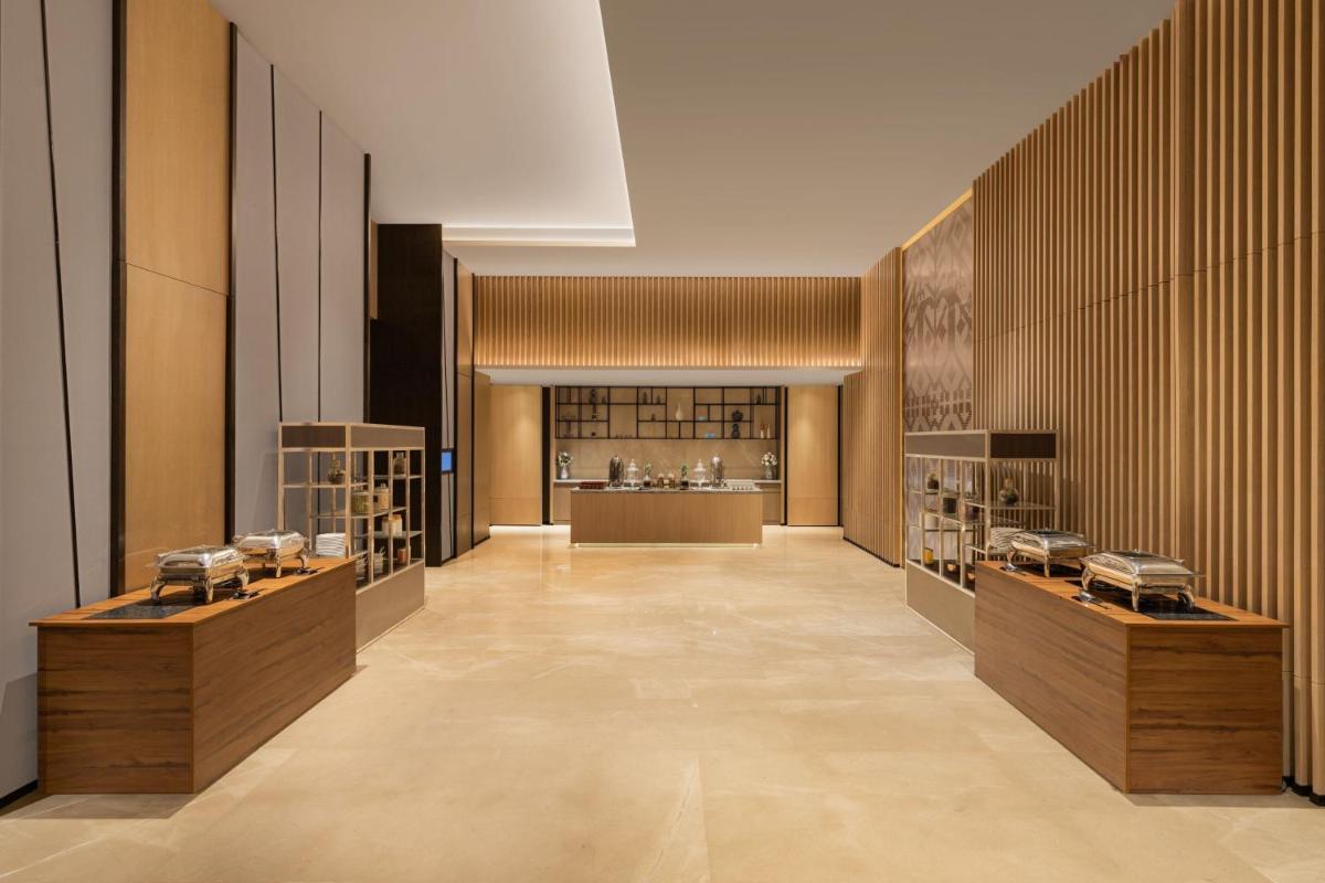 a large room with shelves of wine bottles at Fairfield by Marriott Dehradun in Dehradun
