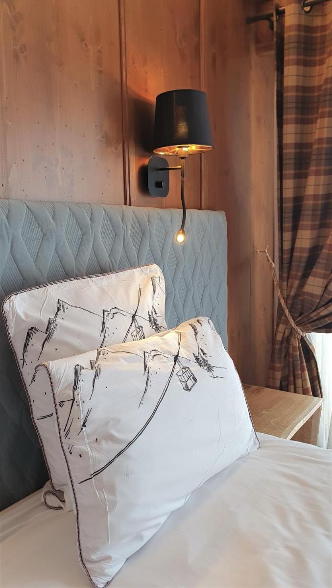 Un ou plusieurs lits dans un hébergement de l'établissement Hôtel Macchi Restaurant & Spa