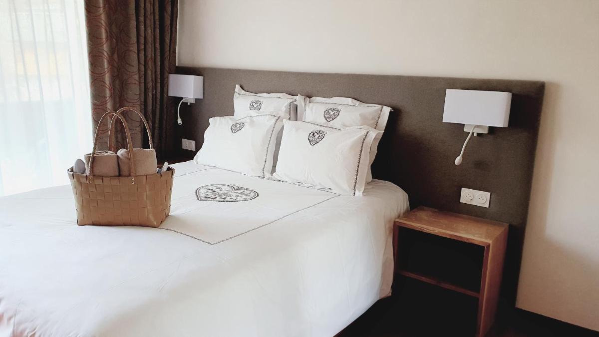 Un ou plusieurs lits dans un hébergement de l'établissement Hôtel Macchi Restaurant & Spa