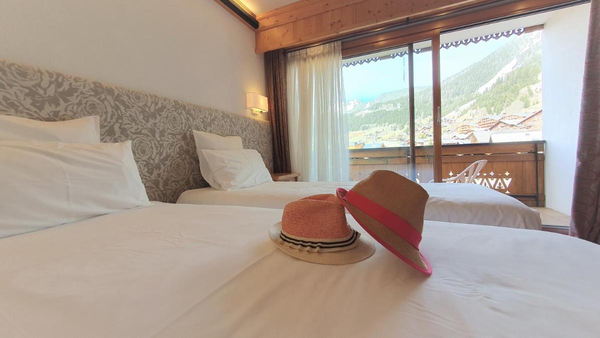 Un ou plusieurs lits dans un hébergement de l'établissement Hôtel Macchi Restaurant & Spa