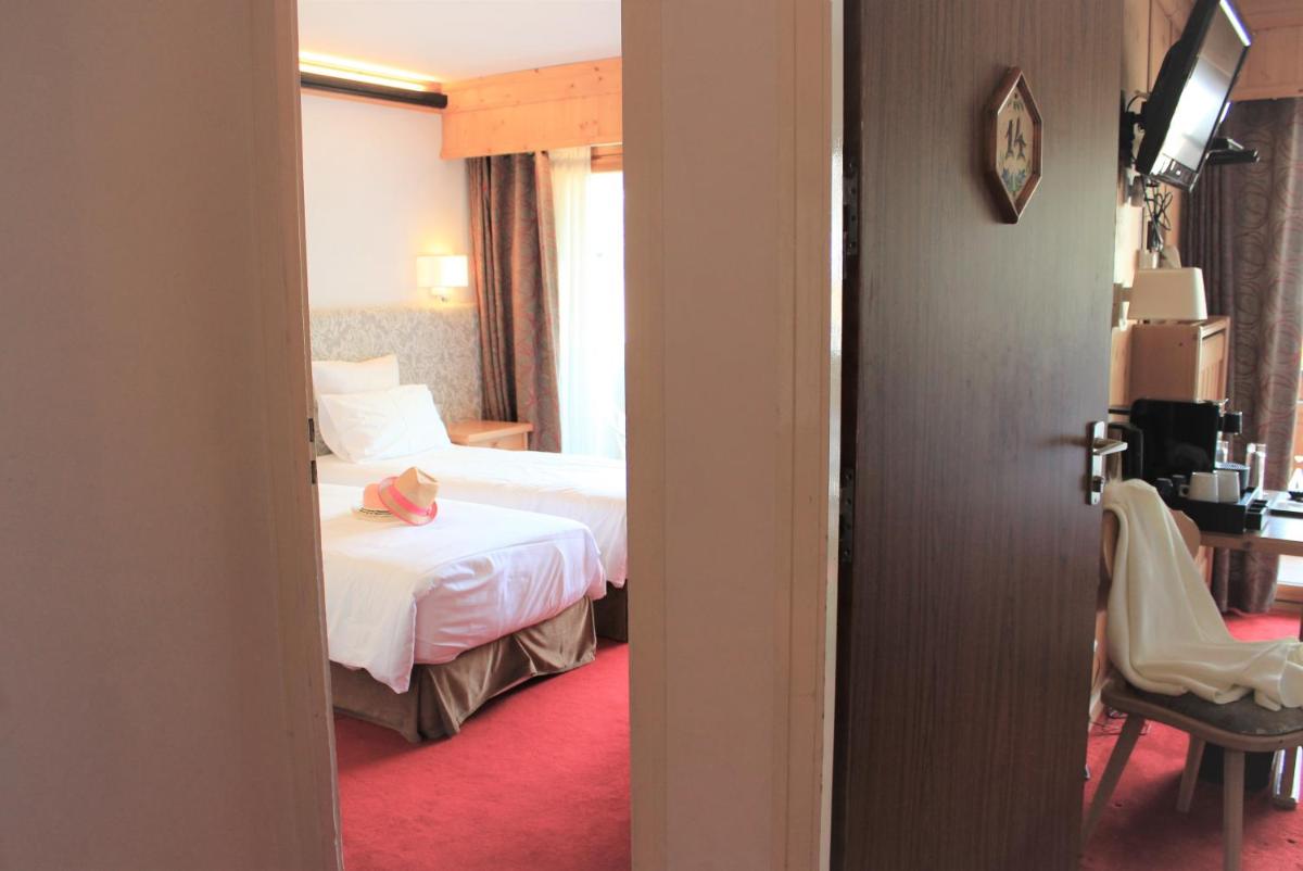 Un ou plusieurs lits dans un hébergement de l'établissement Hôtel Macchi Restaurant & Spa