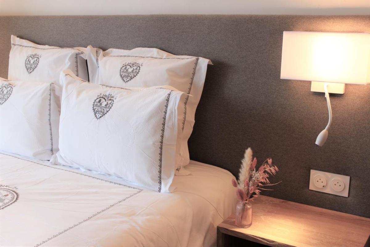 Un ou plusieurs lits dans un hébergement de l'établissement Hôtel Macchi Restaurant & Spa