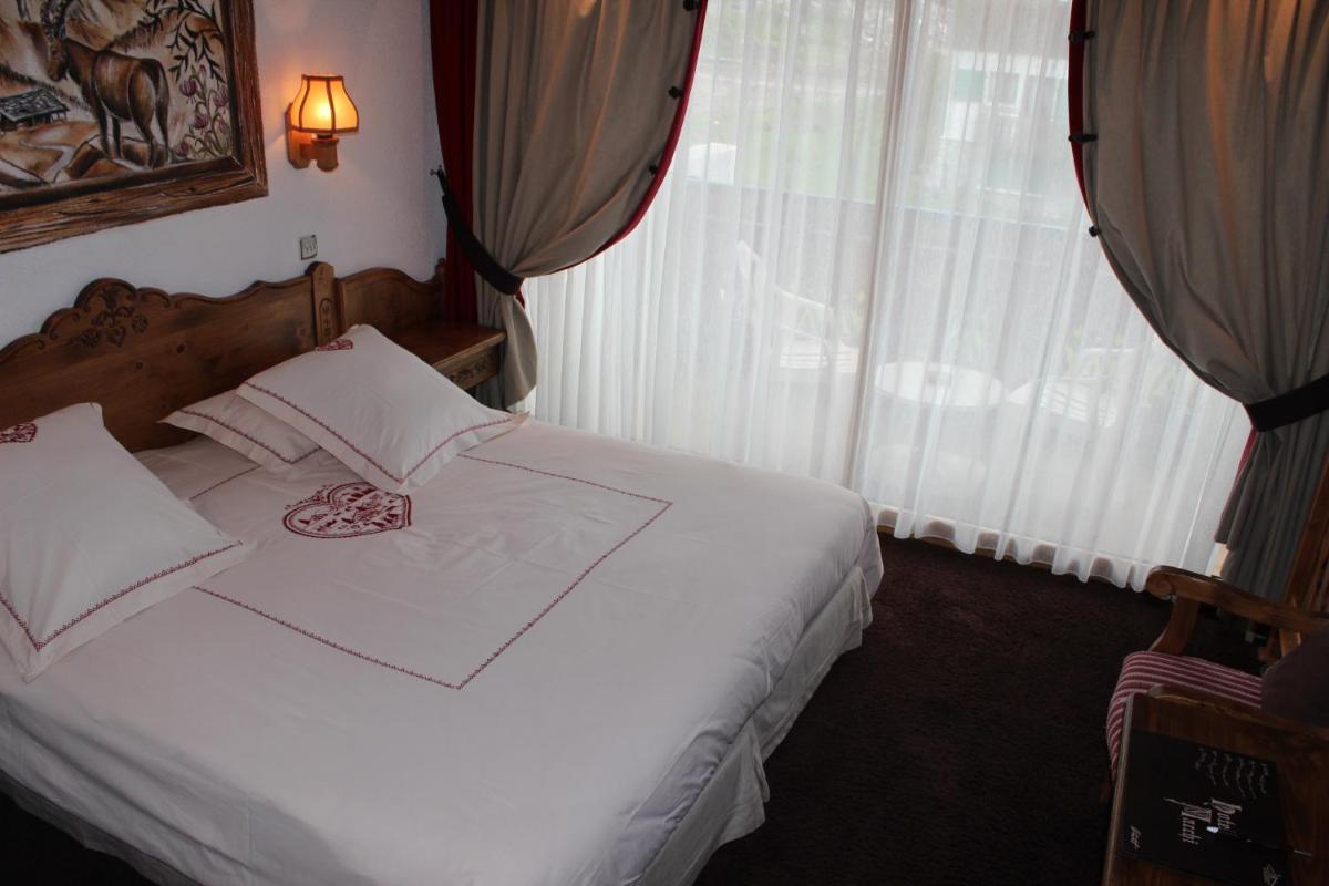 Un ou plusieurs lits dans un hébergement de l'établissement Hôtel Macchi Restaurant & Spa