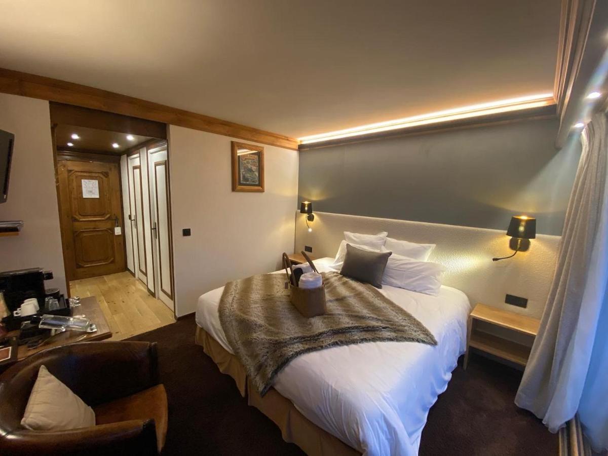 Un ou plusieurs lits dans un hébergement de l'établissement Hôtel Macchi Restaurant & Spa