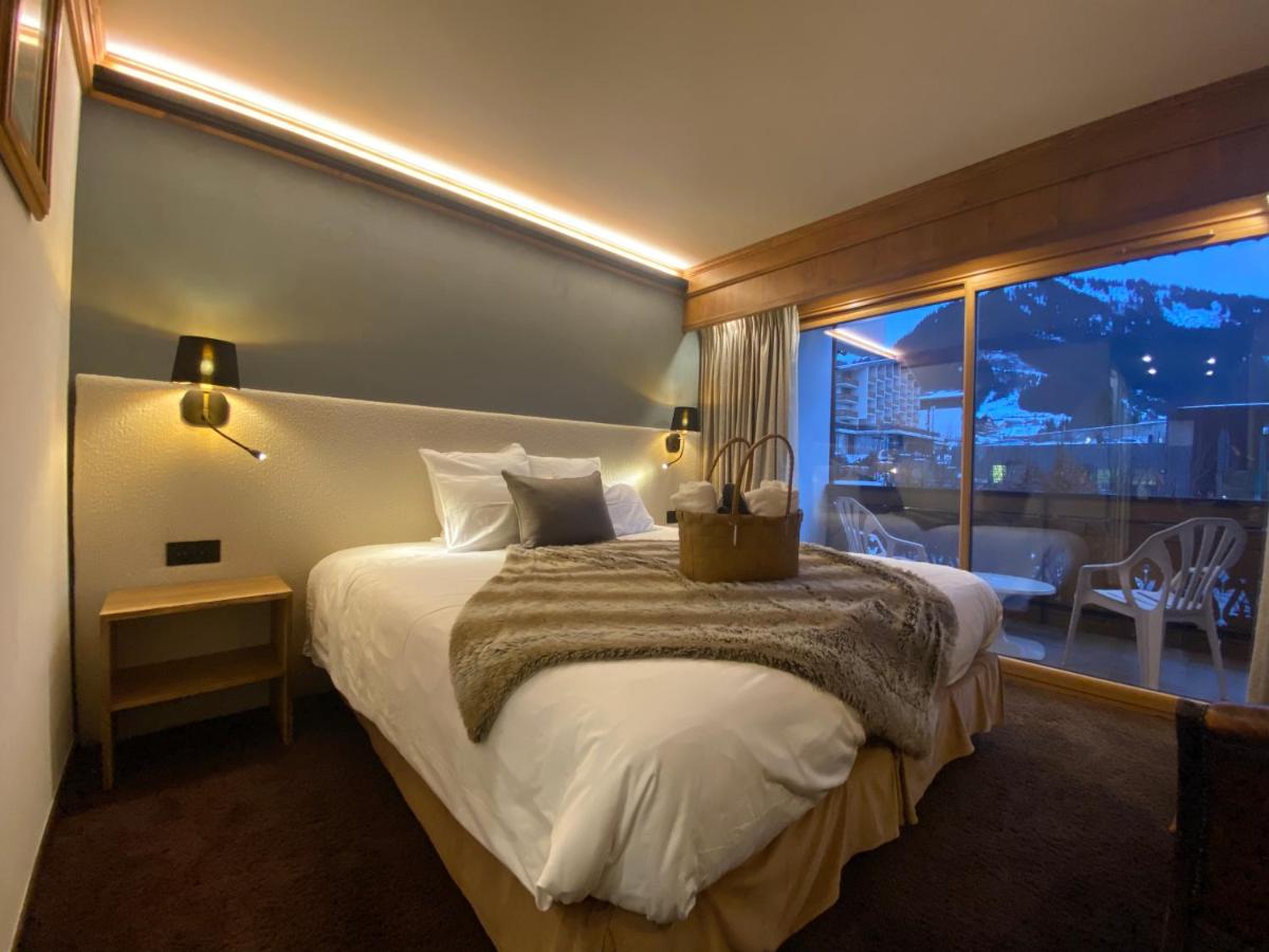 Un ou plusieurs lits dans un hébergement de l'établissement Hôtel Macchi Restaurant & Spa