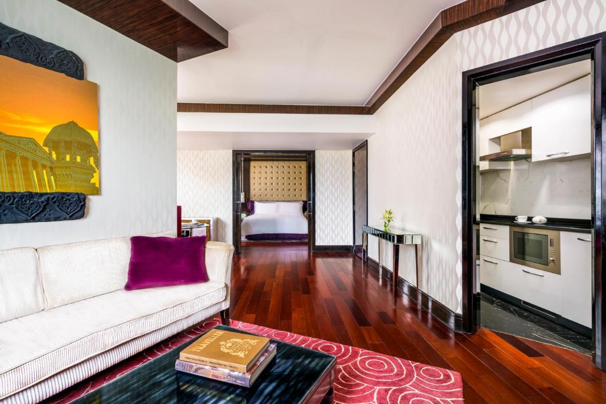 a living room with a couch and a table at Sofitel Mumbai BKC in Mumbai