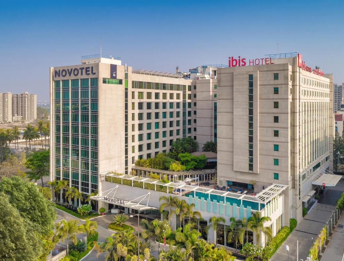 a large building with the los angeles hotel at Novotel Bengaluru Outer Ring Road in Bengaluru