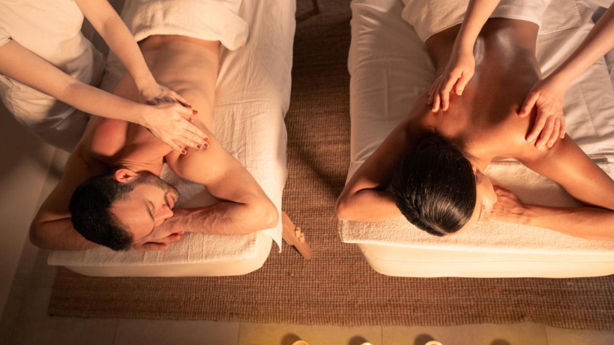 a group of people getting a massage in towels at Novotel Bengaluru Outer Ring Road in Bengaluru