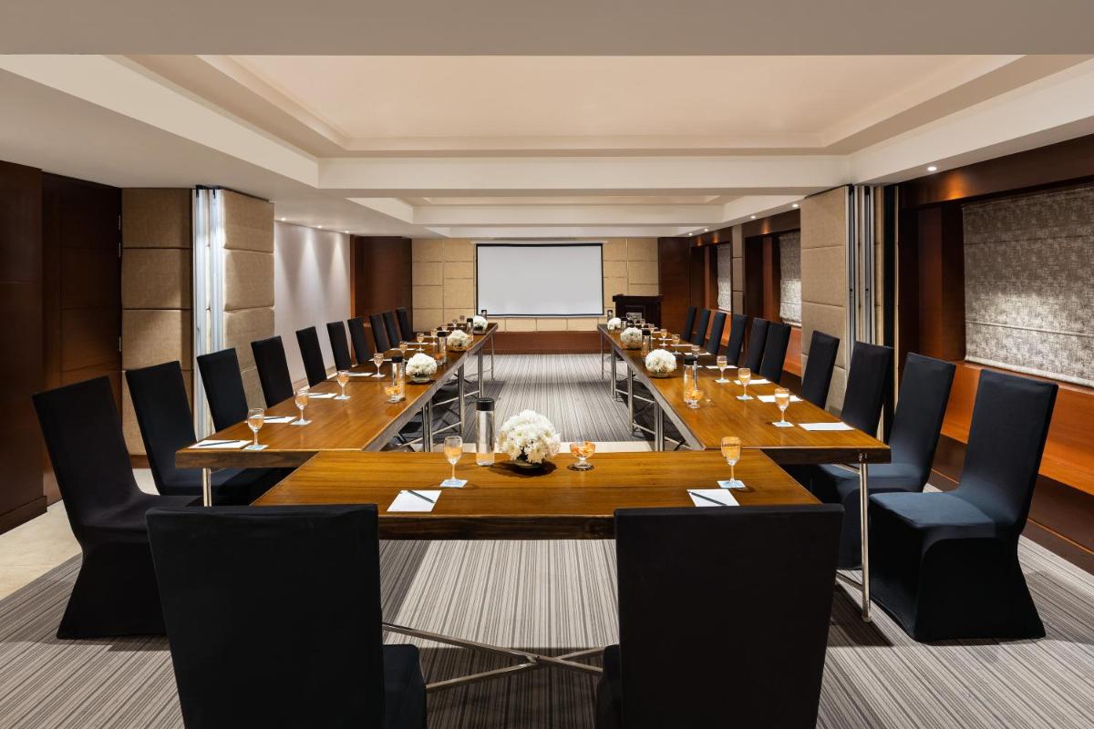a large conference room with a long table and chairs at Radisson Jaipur City Center in Jaipur