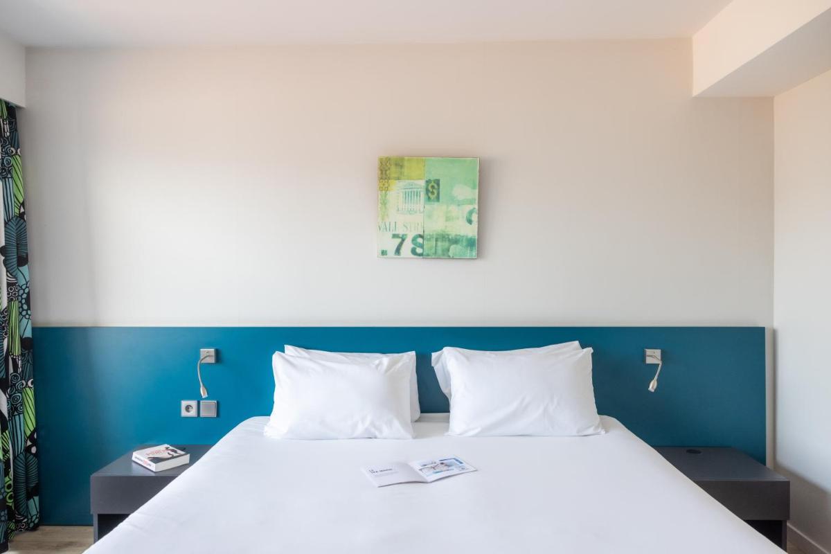 Un ou plusieurs lits dans un hébergement de l'établissement Hôtel Serge Blanco - Relais Thalasso & Spa