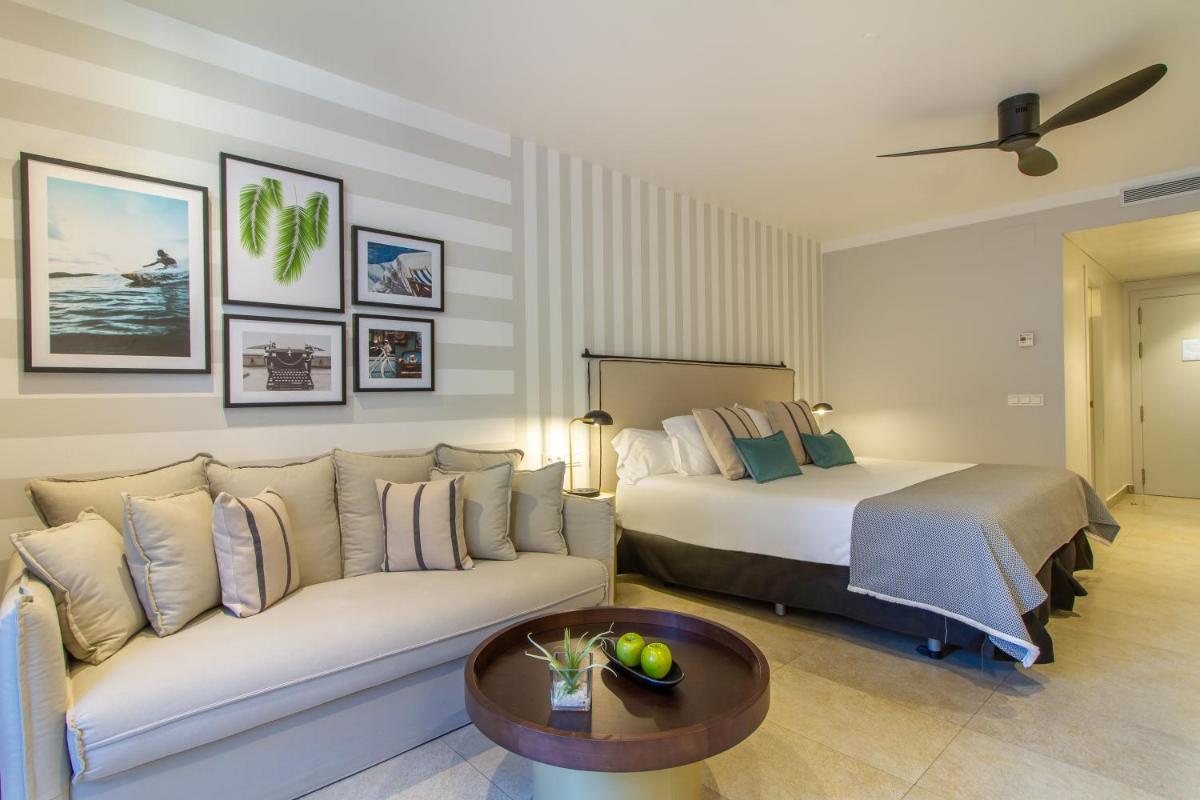 Cama o camas de una habitación en SOLYMAR Gran Hotel