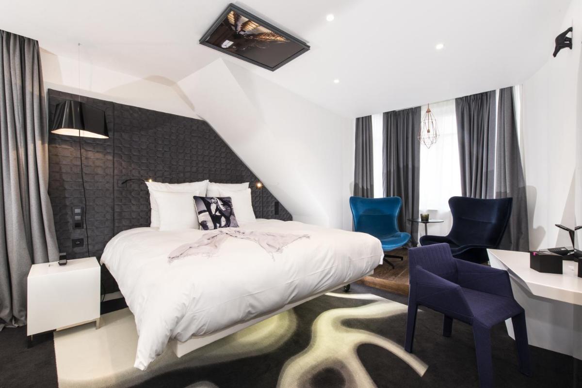 Un ou plusieurs lits dans un hébergement de l'établissement Vertigo Hotel, By Marriott, a Member of Design Hotels