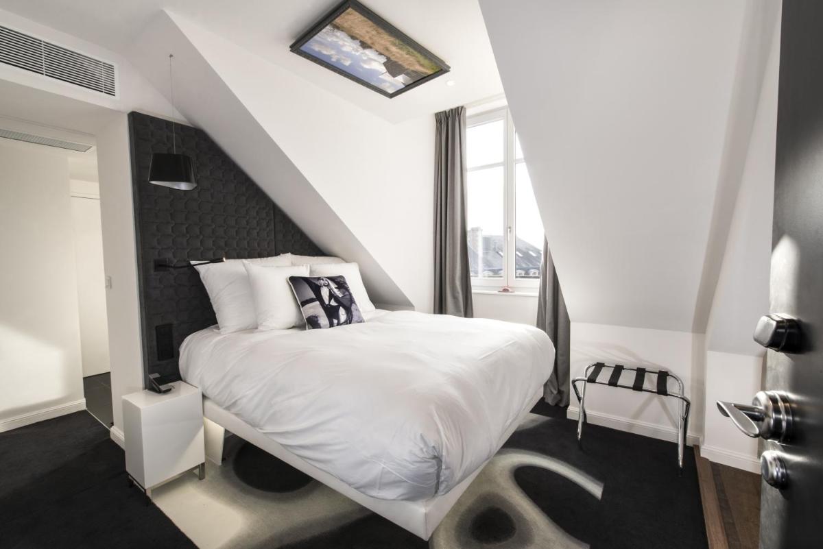Un ou plusieurs lits dans un hébergement de l'établissement Vertigo Hotel, By Marriott, a Member of Design Hotels