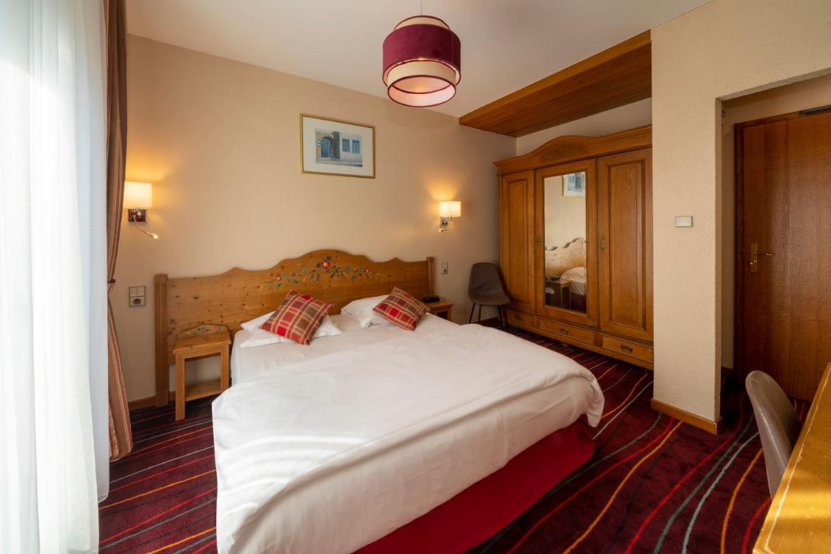Un ou plusieurs lits dans un hébergement de l'établissement Hôtel du Parc, Restaurant, Spa & Wellness