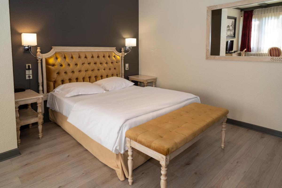 Un ou plusieurs lits dans un hébergement de l'établissement Hôtel du Parc, Restaurant, Spa & Wellness