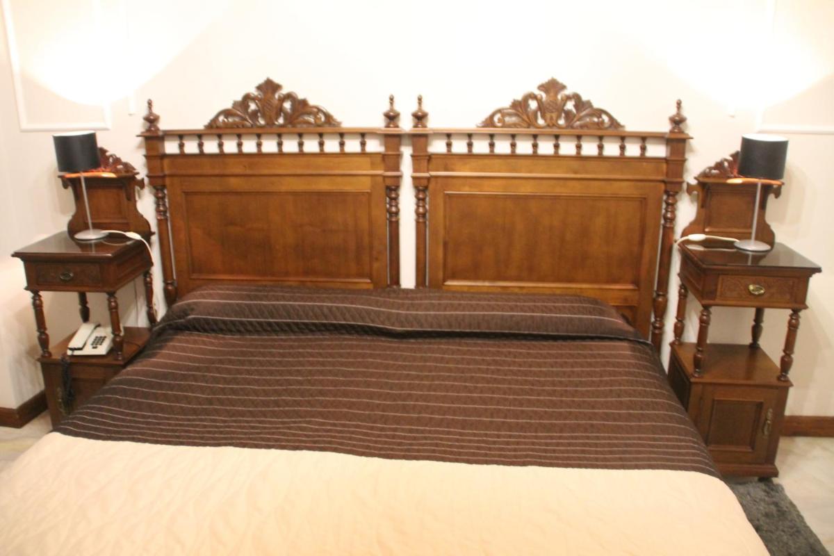 Cama o camas de una habitación en Hotel Palacio de Oñate
