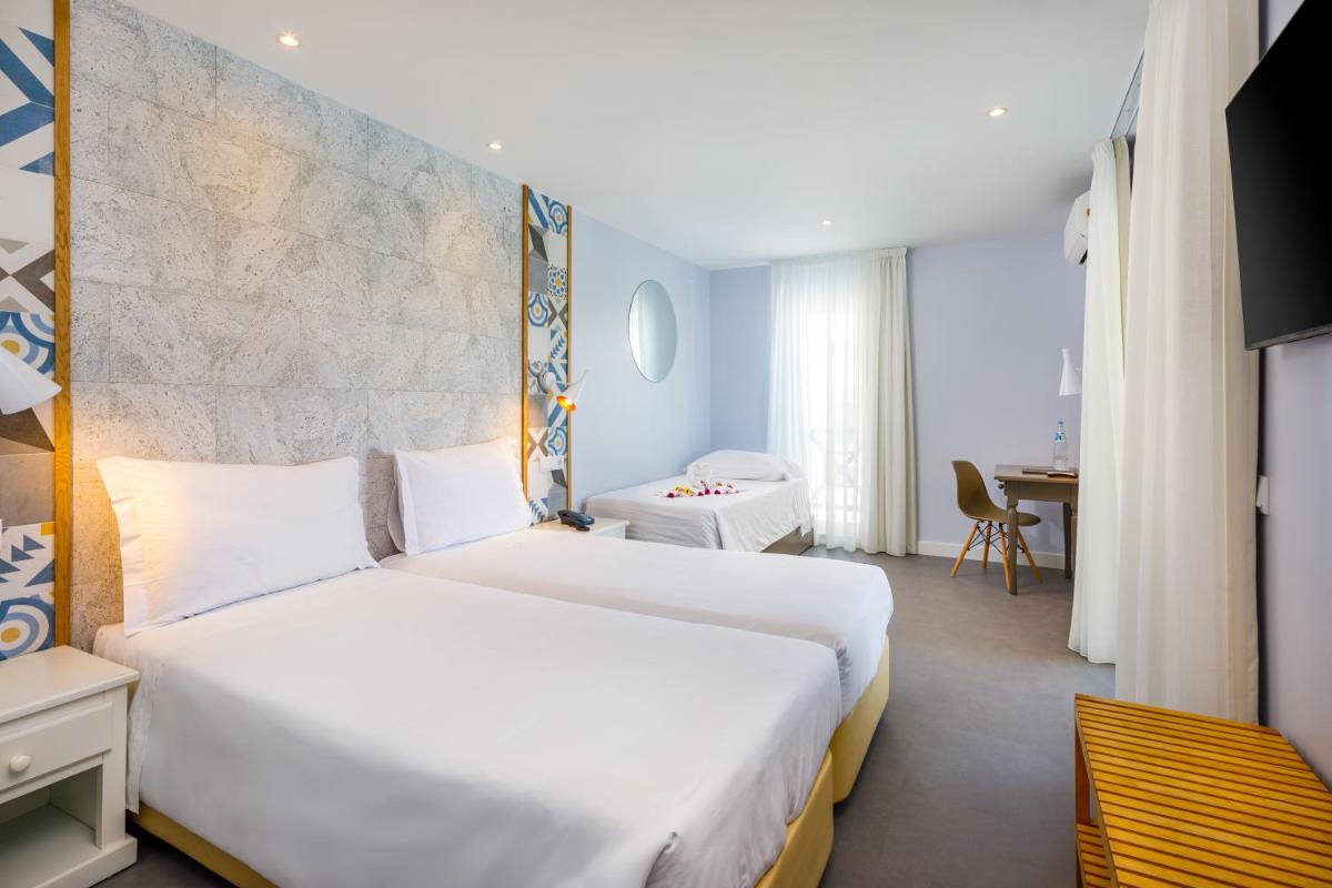 Uma cama ou camas num quarto em AP Adriana Beach Resort