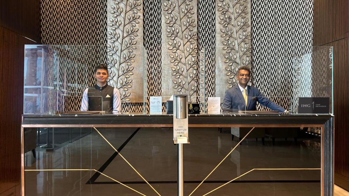 two men sitting at a table in a room at InterContinental Marine Drive Mumbai by IHG in Mumbai