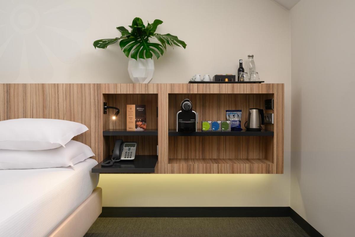 Uma cama ou camas num quarto em Inspira Liberdade Boutique Hotel