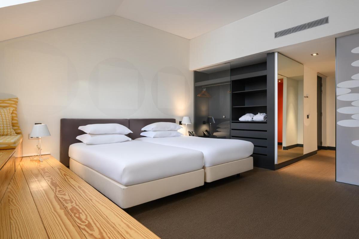 Uma cama ou camas num quarto em Inspira Liberdade Boutique Hotel