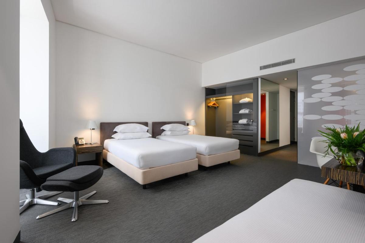 Uma cama ou camas num quarto em Inspira Liberdade Boutique Hotel