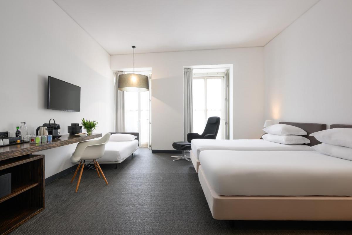 Uma cama ou camas num quarto em Inspira Liberdade Boutique Hotel