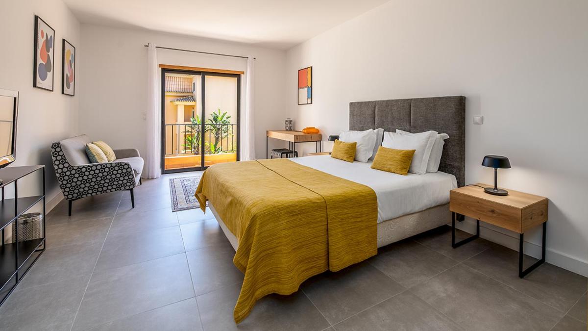 Uma cama ou camas num quarto em Estrela da Luz Resort