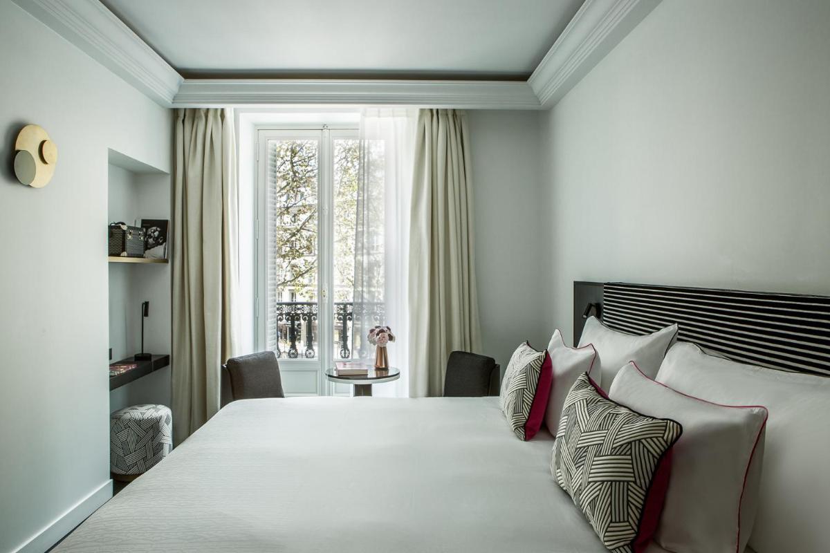Un ou plusieurs lits dans un hébergement de l'établissement Fauchon l'Hôtel Paris