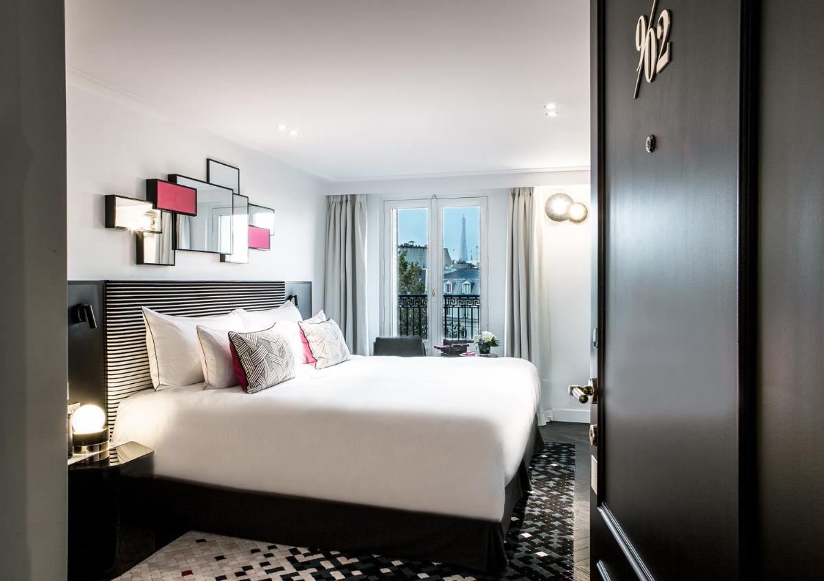 Un ou plusieurs lits dans un hébergement de l'établissement Fauchon l'Hôtel Paris