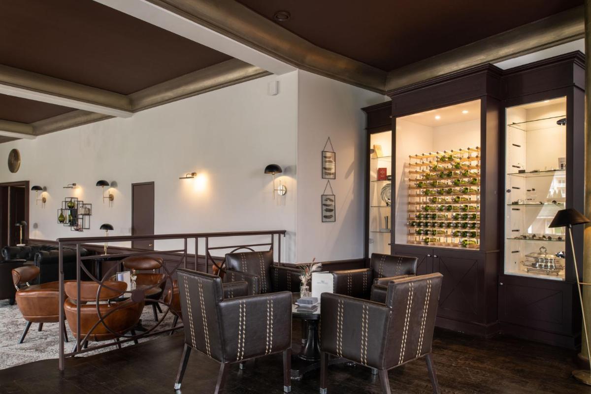 Restaurant ou autre lieu de restauration dans l'établissement Hôtel Beau Rivage