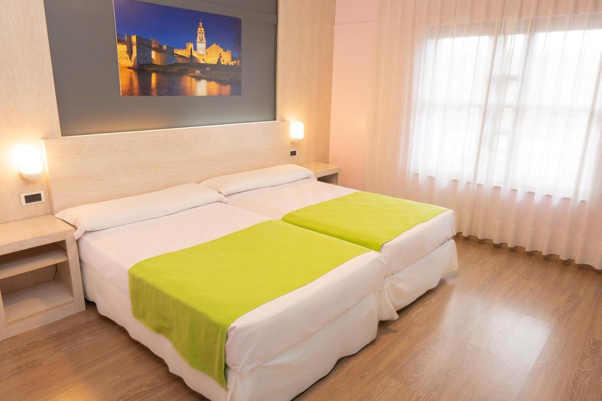 Cama o camas de una habitación en Hotel Spa Rio Ucero