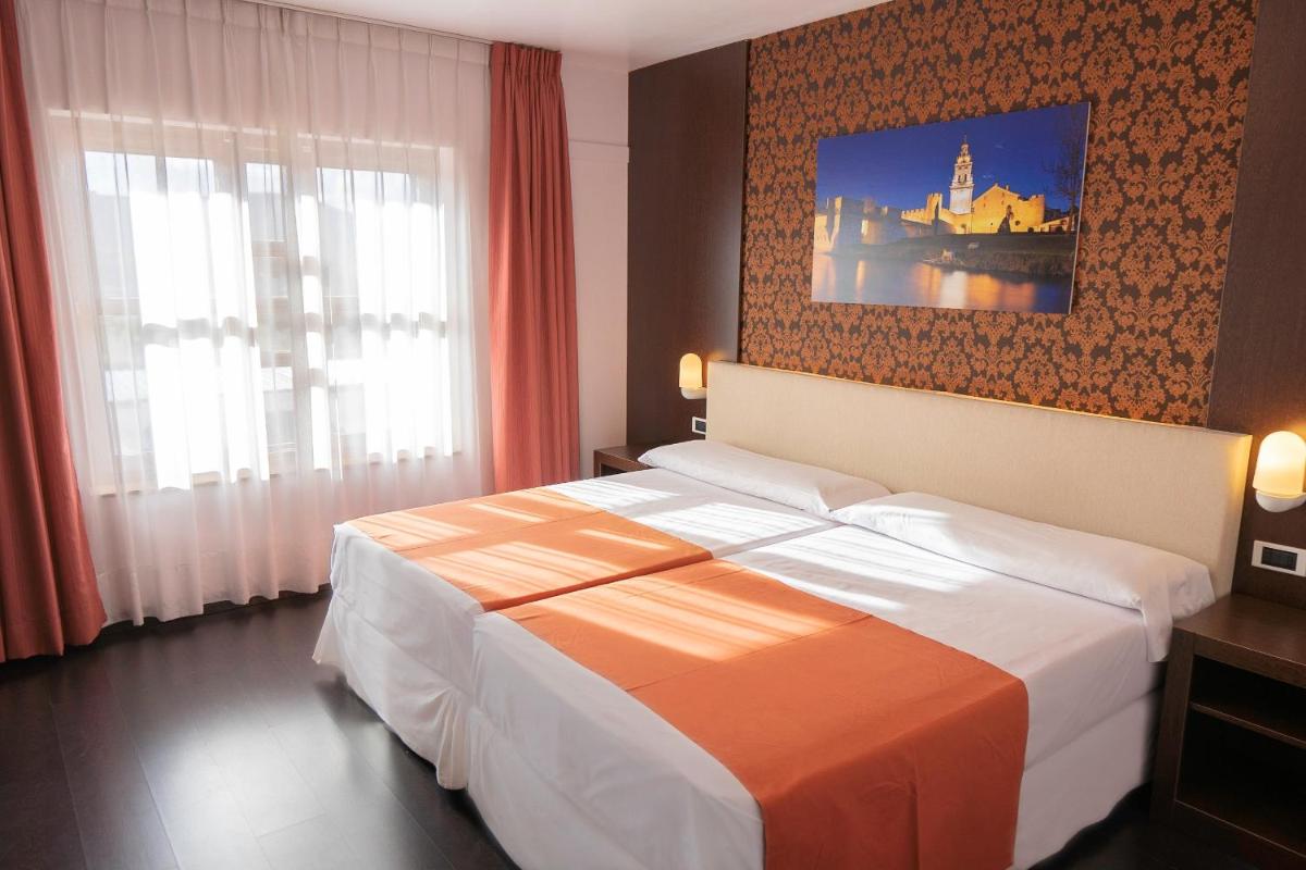 Cama o camas de una habitación en Hotel Spa Rio Ucero