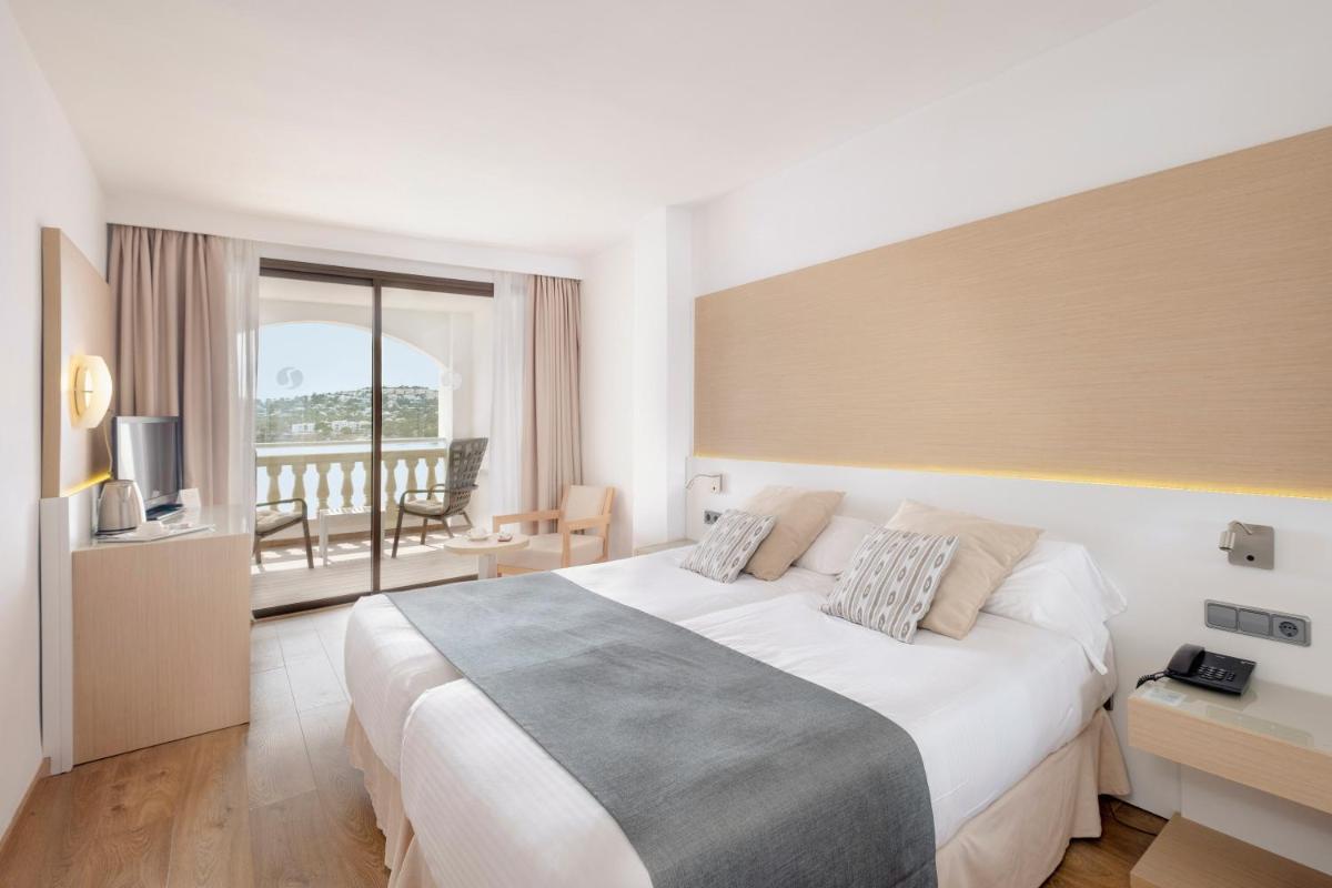 Cama o camas de una habitación en Sentido Fido Punta del Mar Hotel & Spa - Adults Only