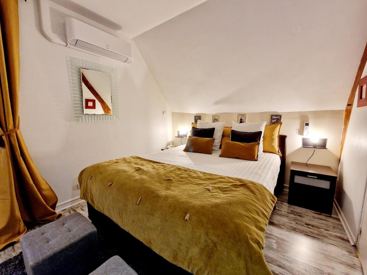 Un ou plusieurs lits dans un hébergement de l'établissement Les Terrasses de Saumur - Hôtel & Appartements - Restaurant & Spa (Logis)
