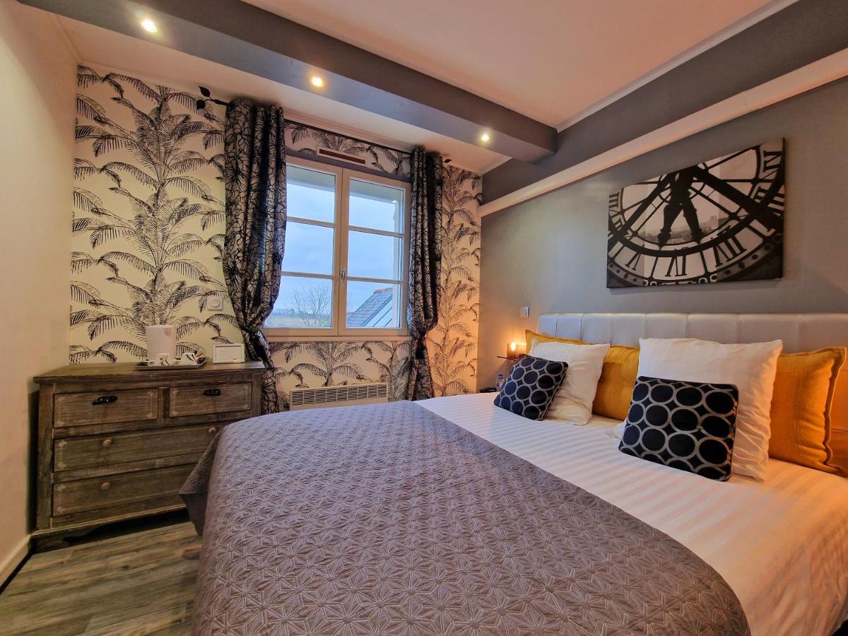Un ou plusieurs lits dans un hébergement de l'établissement Les Terrasses de Saumur - Hôtel & Appartements - Restaurant & Spa (Logis)