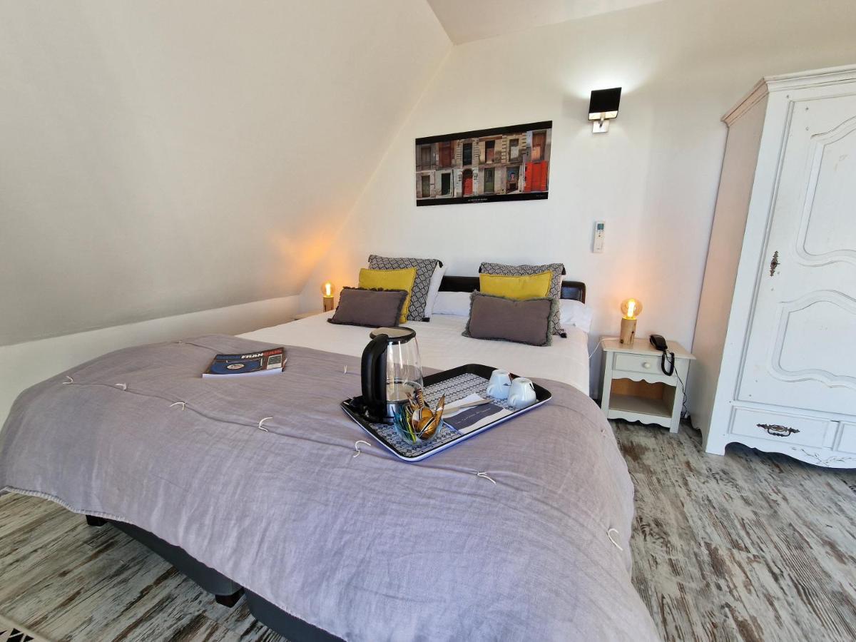 Un ou plusieurs lits dans un hébergement de l'établissement Les Terrasses de Saumur - Hôtel & Appartements - Restaurant & Spa (Logis)