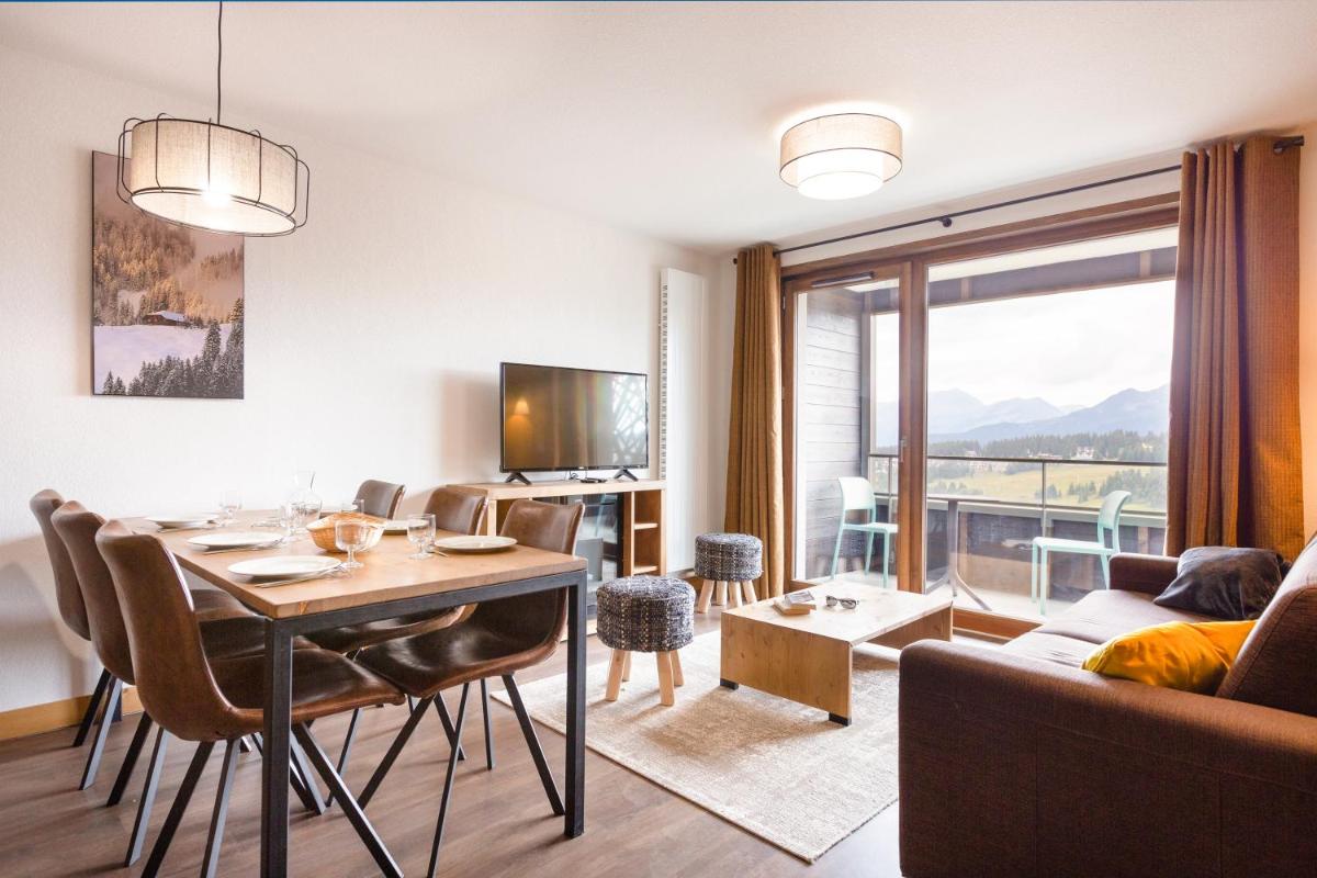 Coin salon dans l'établissement Résidence Club MMV Les Chalets des Cimes