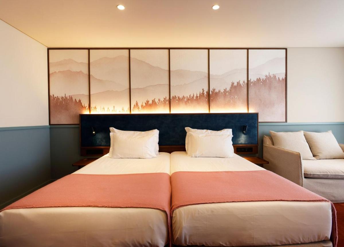 Uma cama ou camas num quarto em Montebelo Viseu Congress Hotel & Spa