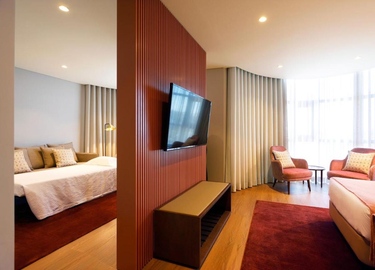 Uma cama ou camas num quarto em Montebelo Viseu Congress Hotel & Spa