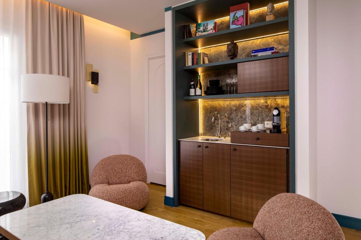 Un ou plusieurs lits dans un hébergement de l'établissement Hôtel Bel Ami