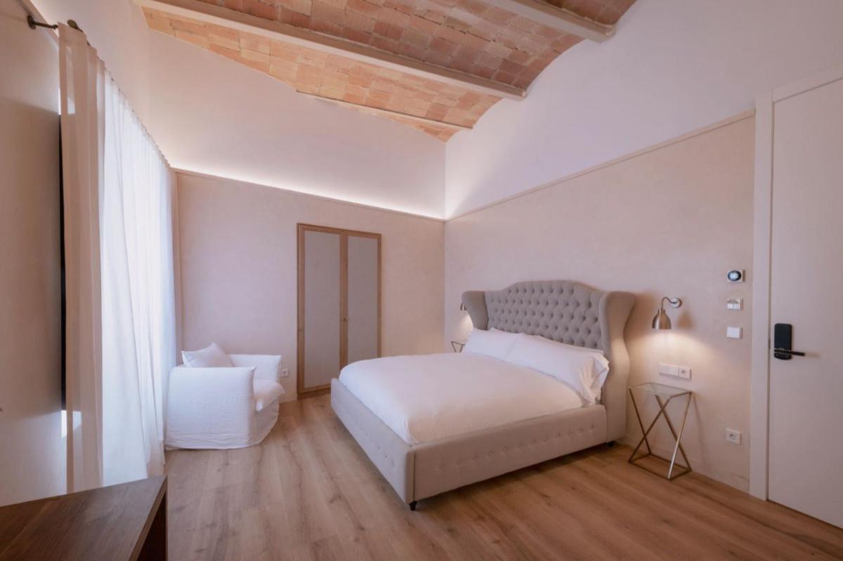 Cama o camas de una habitación en Hotel Palau Macelli & Spa