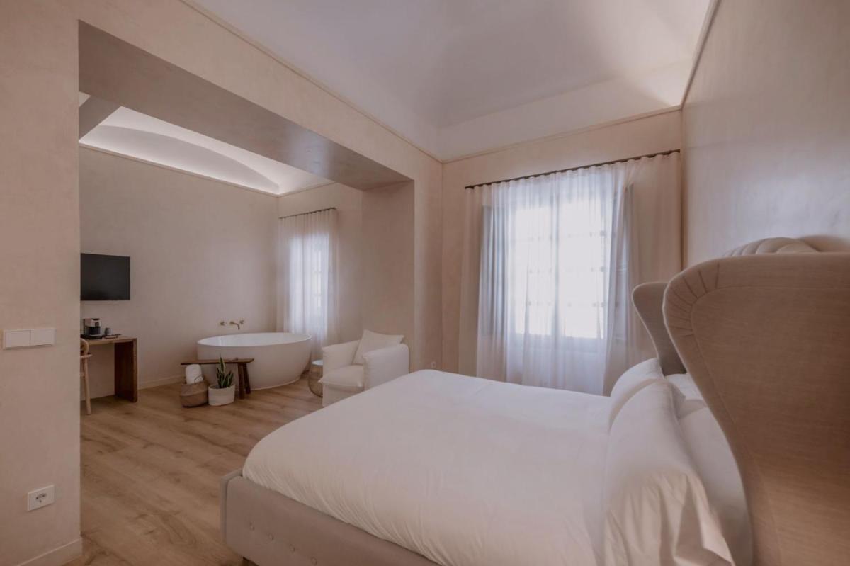 Cama o camas de una habitación en Hotel Palau Macelli & Spa