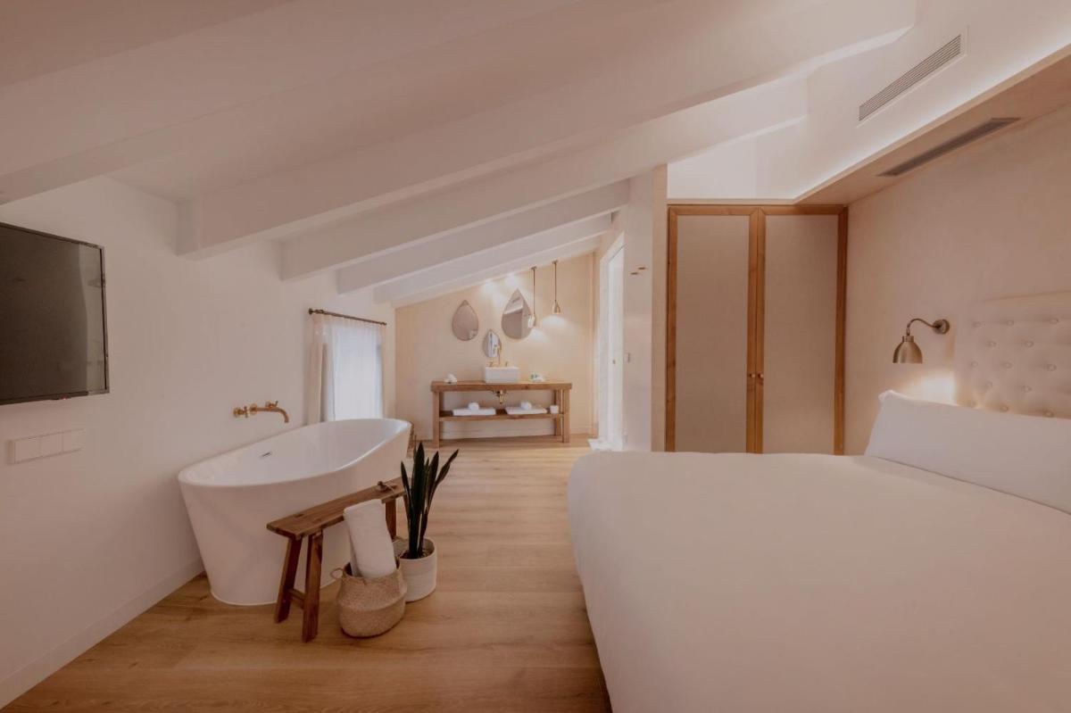 Cama o camas de una habitación en Hotel Palau Macelli & Spa