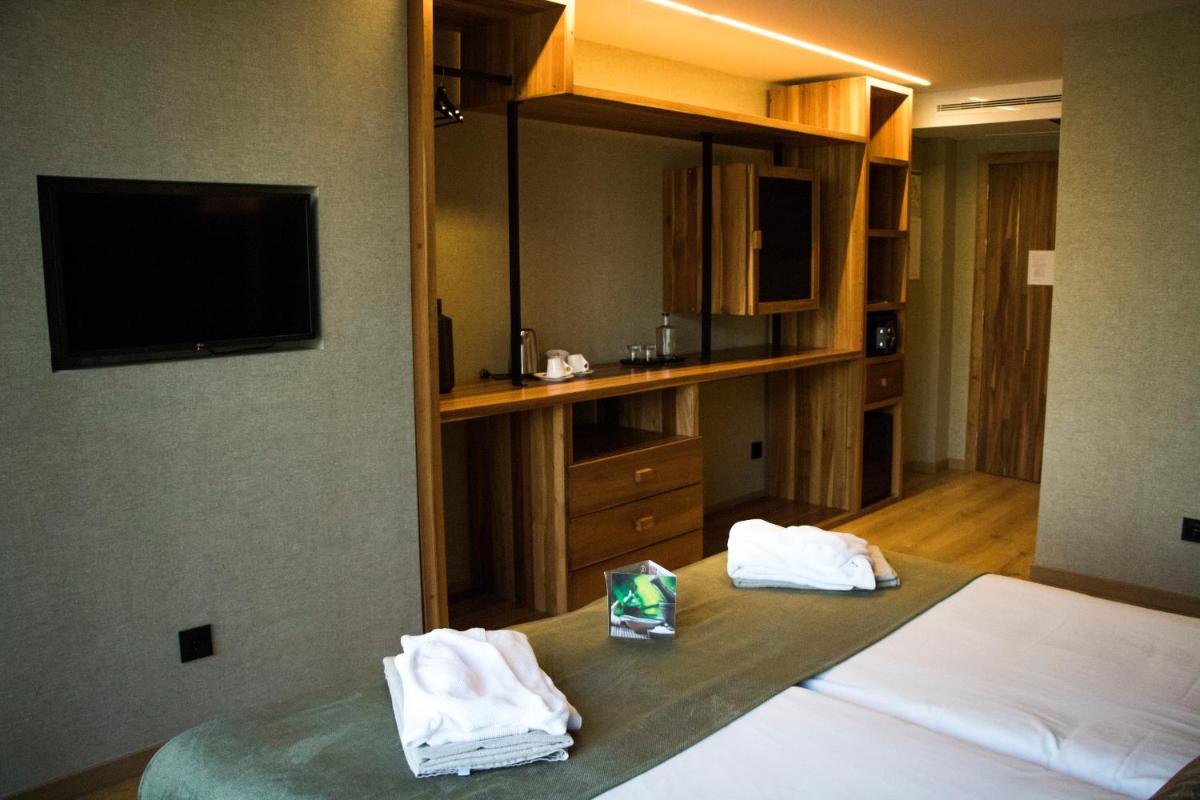 Uma cama ou camas num quarto em Well Hotel & Spa
