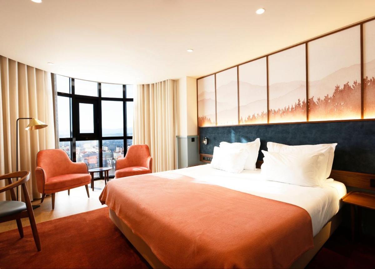 Uma cama ou camas num quarto em Montebelo Viseu Congress Hotel & Spa