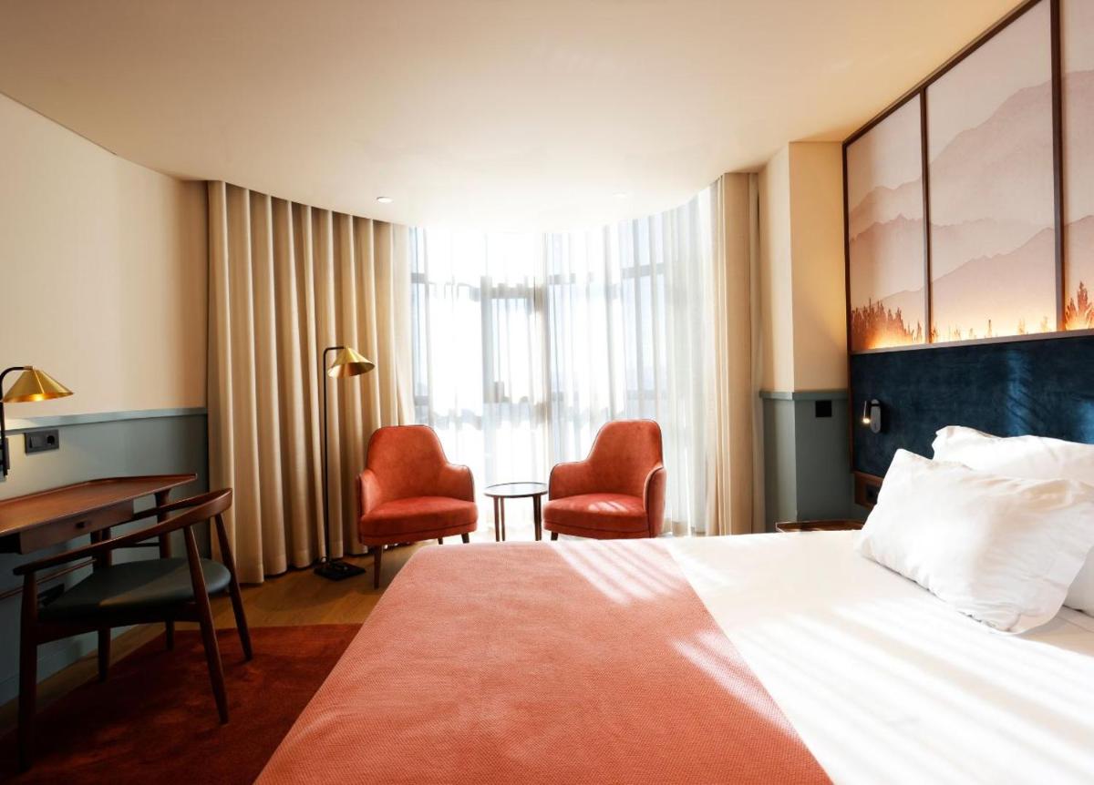 Uma cama ou camas num quarto em Montebelo Viseu Congress Hotel & Spa